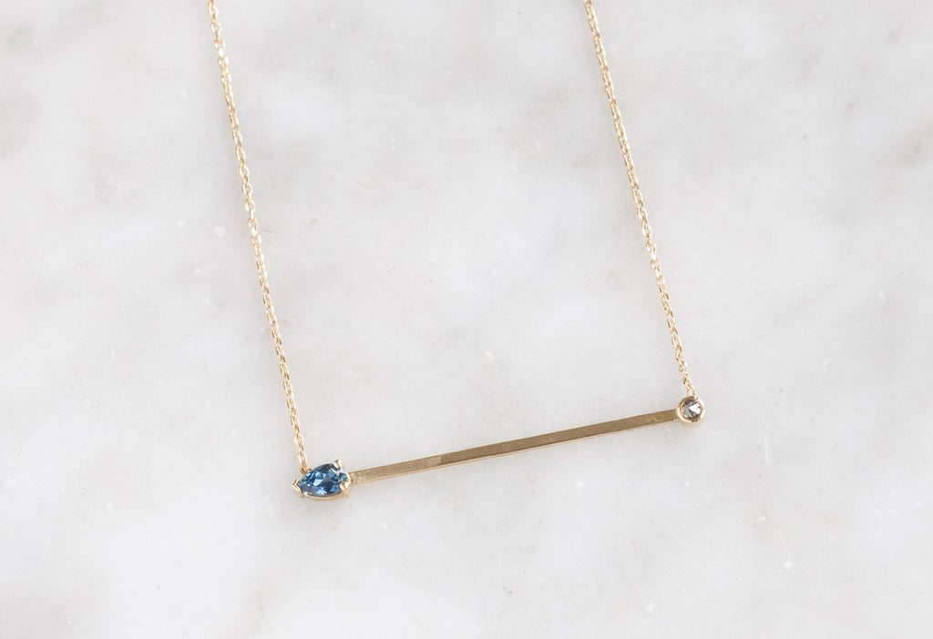 Montana Sapphire + Diamond Necklace on Marble