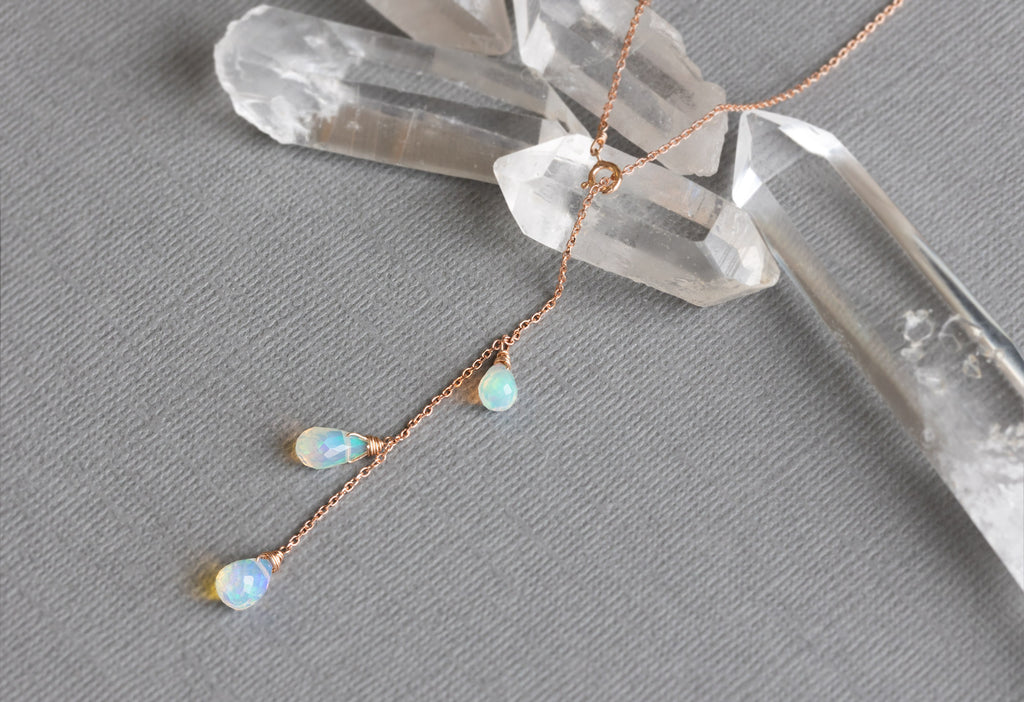 Natural Opal Cascade Lariat Necklace in Rose Gold on Grey Textured Paper