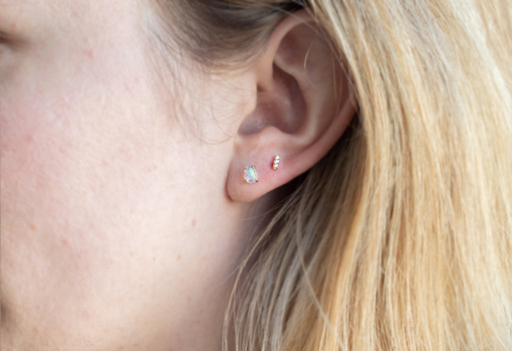 Opal Teardrop Stud Earrings Stacked on MOdel