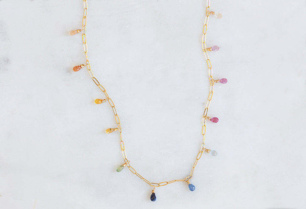 Rainbow Sapphire Briolette Necklace on Marble Tile
