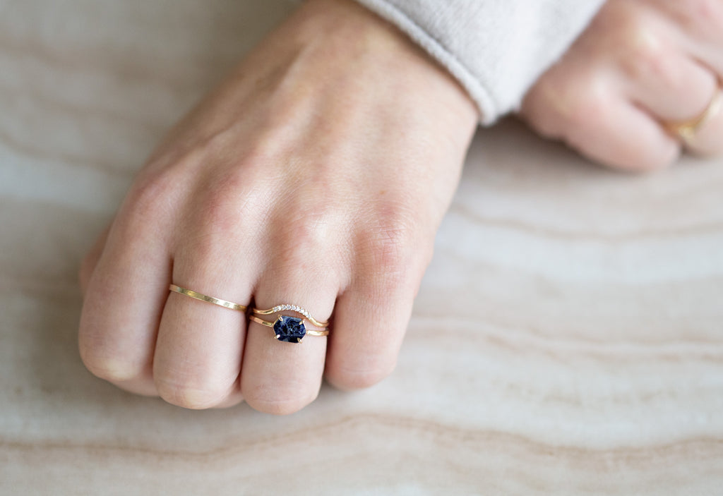 Raw Montana Sapphire Hexagon Ring with stacking band on hand
