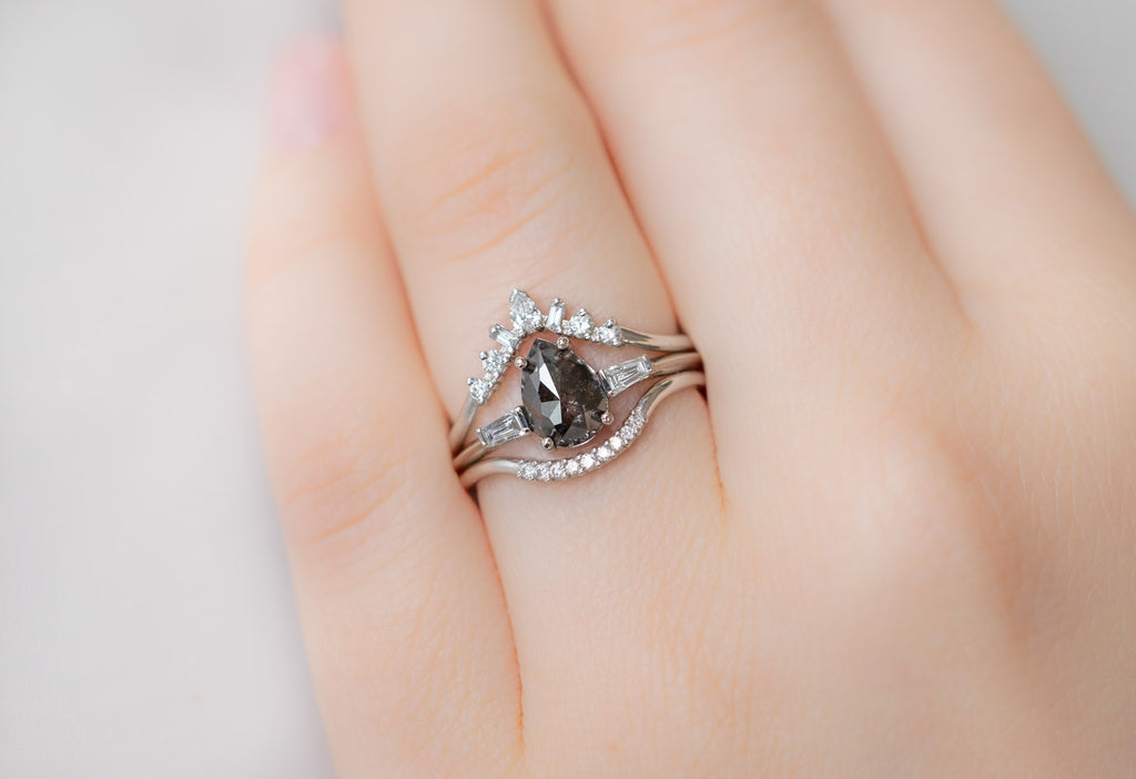 The Ash Ring with a Rose-Cut Black Diamond with White Diamond Stacking Bands on Model