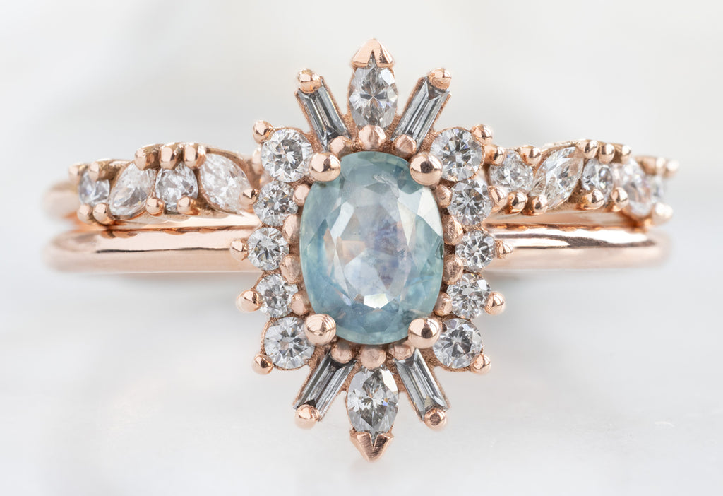 The Camellia Ring with an Oval-Cut Montana Sapphire with Marquise Confetti Stacking Band