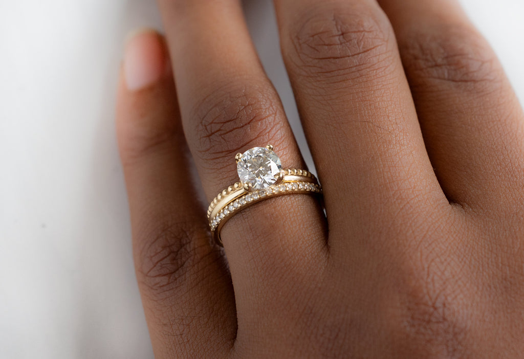 The Duo Band Ring with a Round Lab Grown Diamond with Pavé Diamond Stacking Band on Model