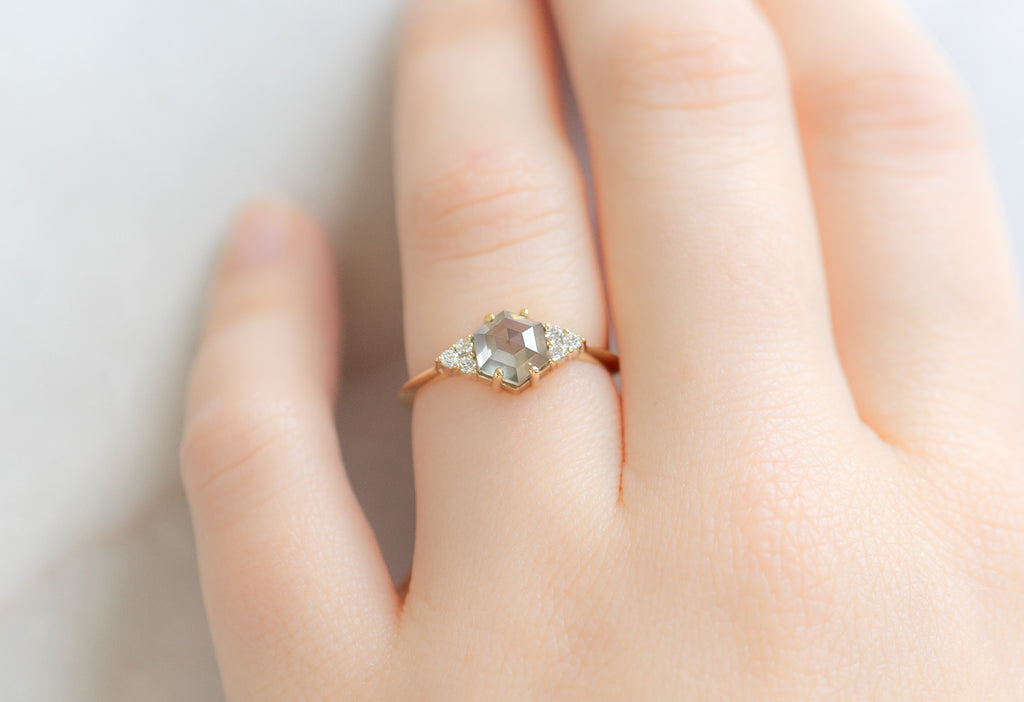 The Ivy Ring with a Green Hexagon Diamond on Model
