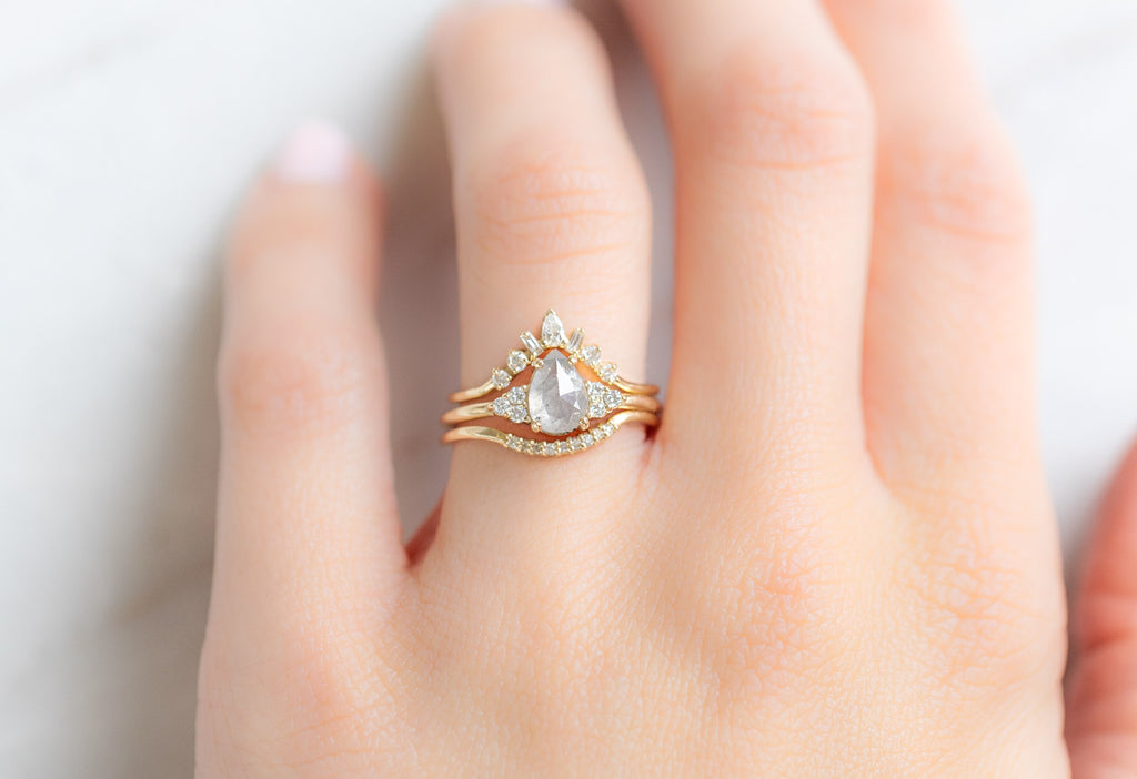 The Ivy Ring with a Rose-Cut Icy White Diamond with White Diamond Stacking Bands on Model