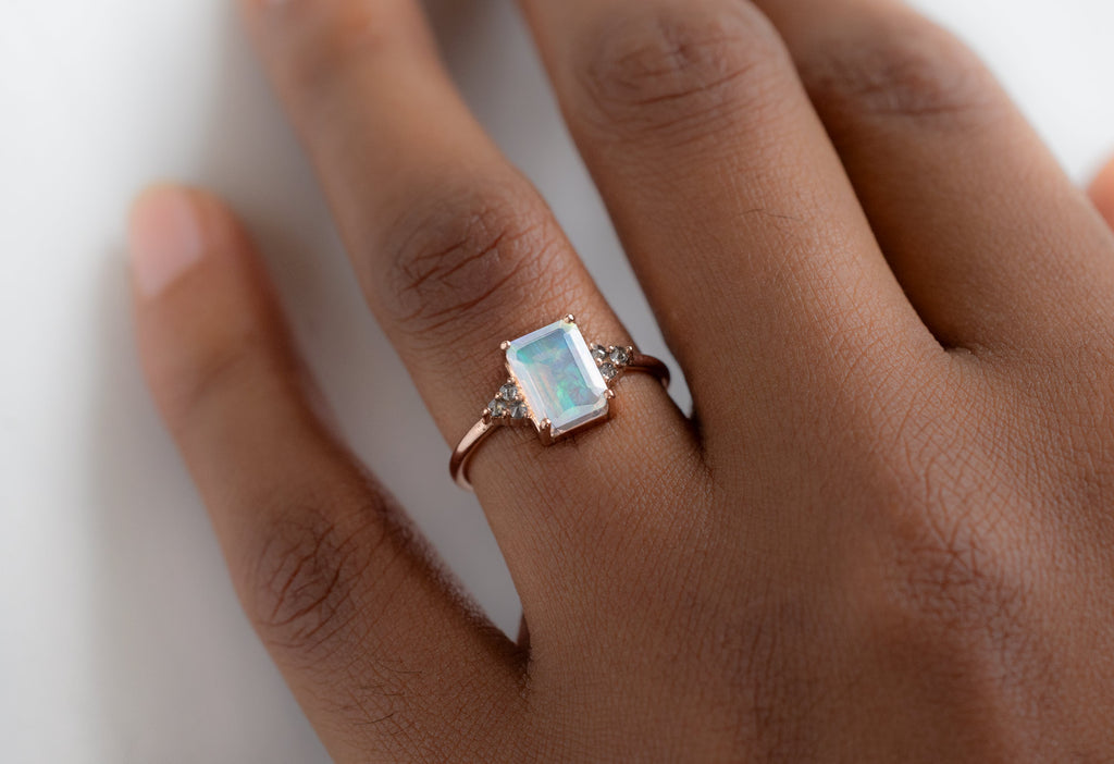The Ivy Ring with an Emerald-Cut Opal on Model