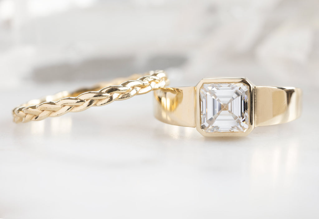 The Signet Ring with an Asscher-Cut Lab Grown Diamond with the Braided Stacking Band