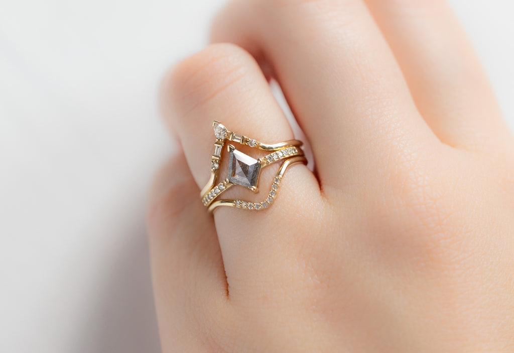 The Willow Ring with a Silvery-Grey Kite Diamond with White Diamond Stacking Bands on Model