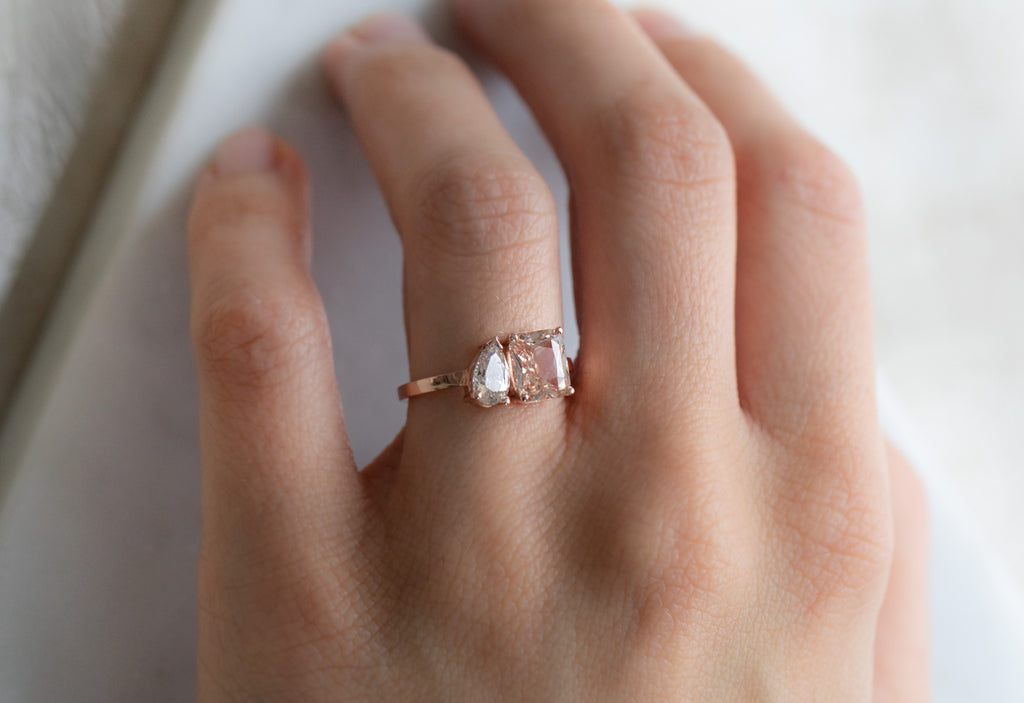 'You & Me' Ring with a Peach Sapphire + Pear-Cut Diamond on Model